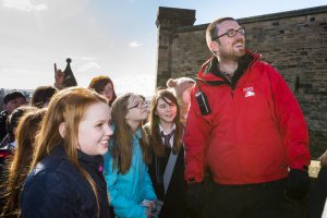 Nathan leads a school tour of the castle