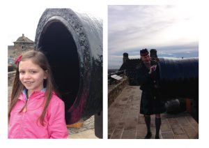 Visitor to Edinburgh Castle and a soldier based there stand next to Mons Meg
