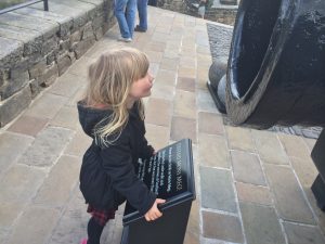 Little Girl looking at Mons Meg cannon