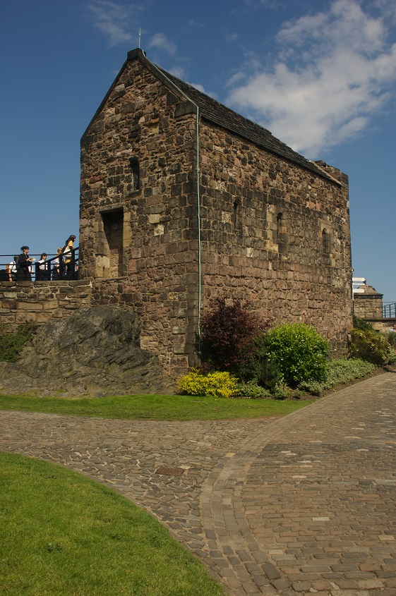 A small stone chapel set within a castle complex