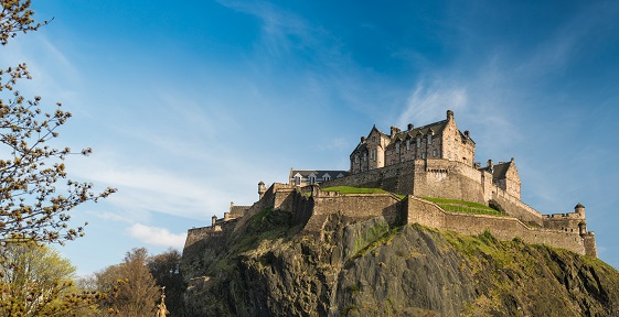 View of the west defences and hospital of Edinburgh Castle from Princes Gardens, Ross fountain in the foreground (with seagull) Edinburgh Castle