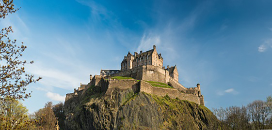 View of the west defences and hospital of Edinburgh Castle from Princes Gardens, Ross fountain in the foreground (with seagull) Edinburgh Castle