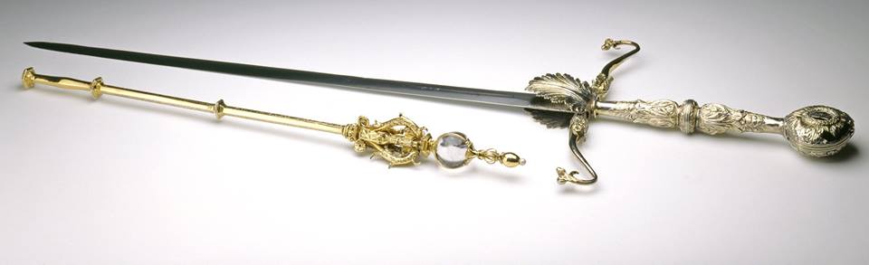 A ornate Sword of State with a detailed golden handle and silver blade. 