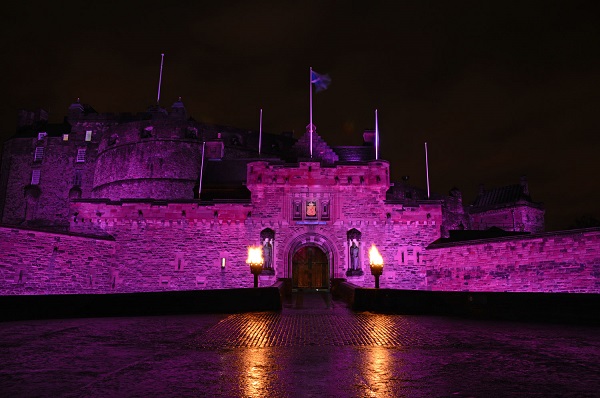 Edinburgh Castle lit up in pink 