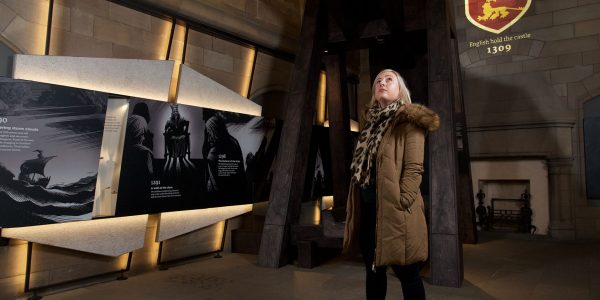 A lady gazing up at the displays at Edinburgh Castle's new exhibition