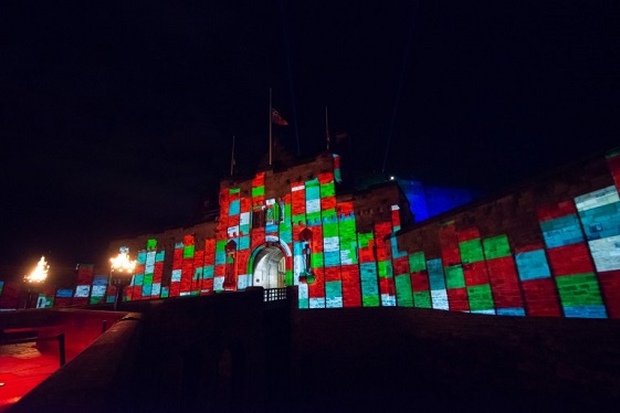 Multicoloured blocks projected onto the side of Edinburgh Castle 