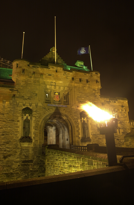 entrance to Edinburgh Castle with brazier or torch burning outside 