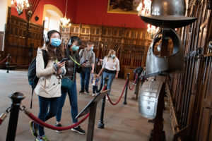 visitors inside the Great Hall at Edinburgh Castle, wearing face coverings to help prevent the spread of COVID-19.