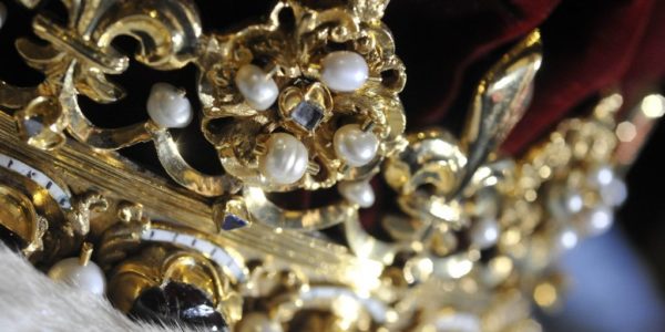 close view of crown with pearls and jewels inlaid