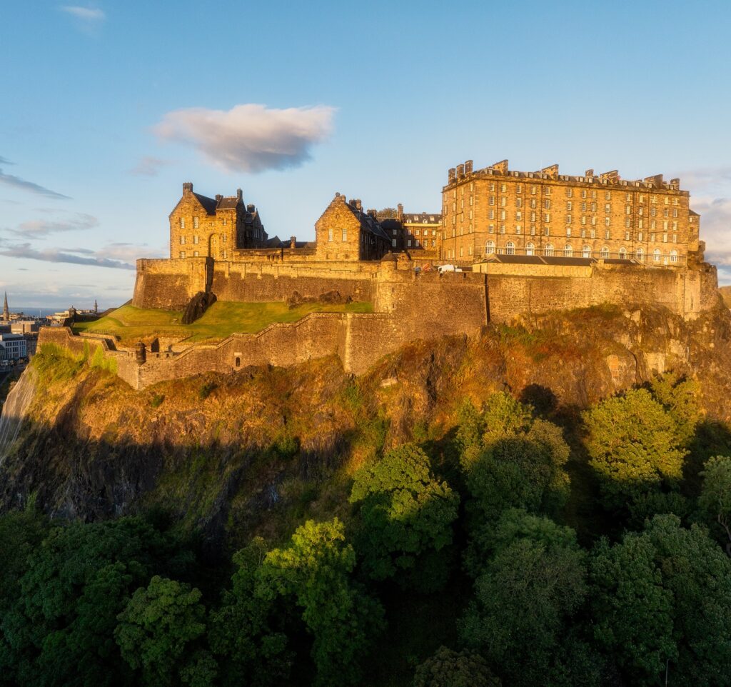 Edinburgh Castle perched on Castle rock in the evening sun. 