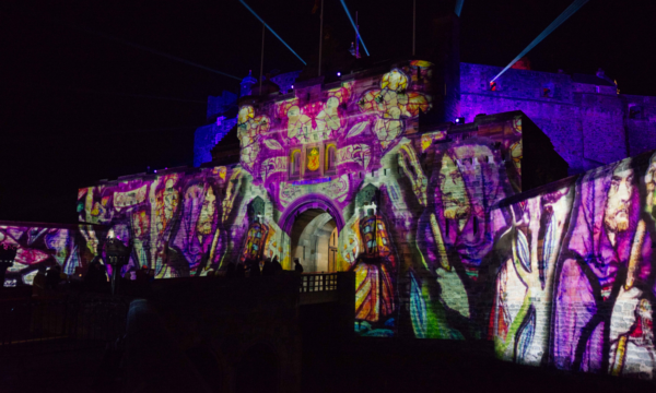 Colourful projections on the front of Edinburgh Castle as part of the Castle of Light event